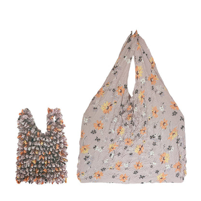 Sac rétractable à main à motif floral