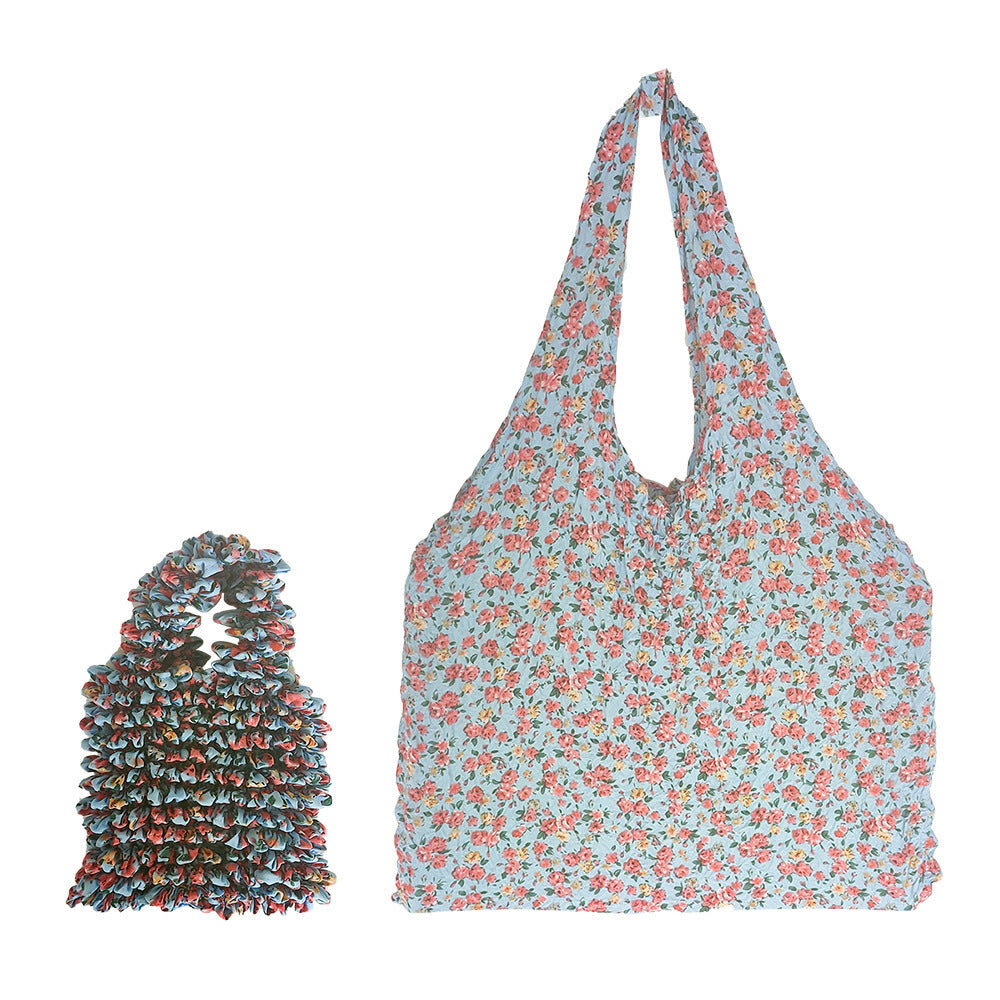 Sac rétractable à main à motif floral